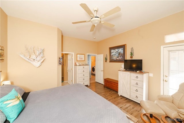 bedroom with ceiling fan, washer / clothes dryer, and wood finished floors