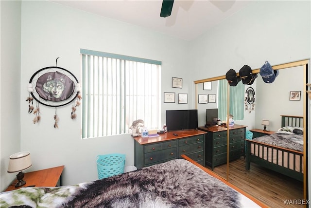 bedroom with a ceiling fan and wood finished floors