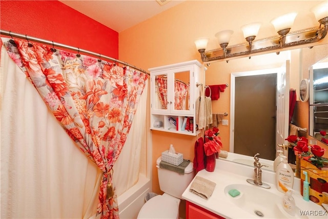 full bath with shower / tub combo, vanity, and toilet