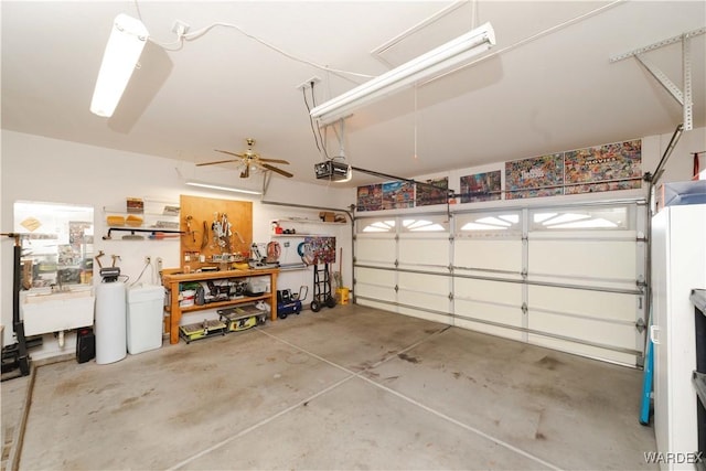 garage featuring a sink and a garage door opener