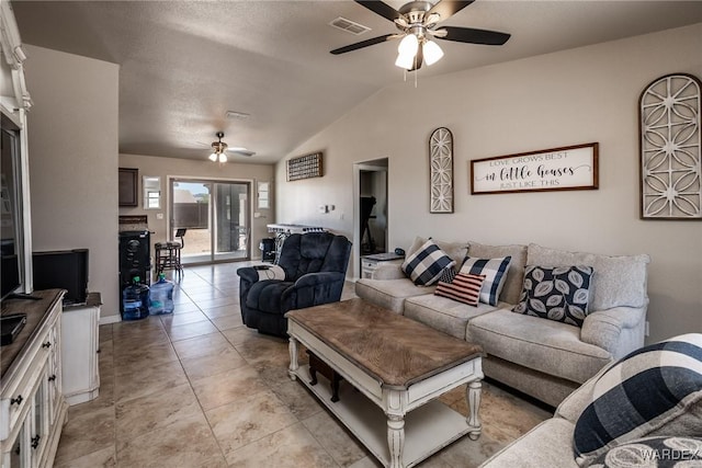 living room with visible vents, a ceiling fan, and lofted ceiling
