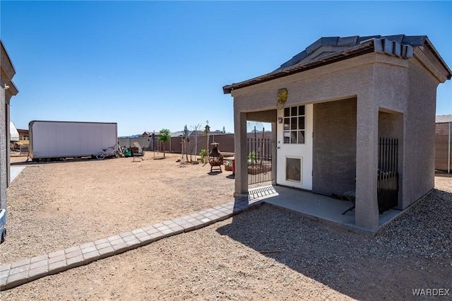 exterior space with fence and a patio