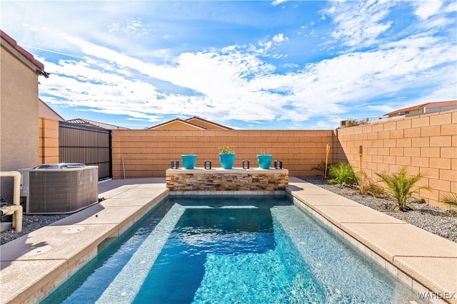 view of pool featuring a fenced backyard, a fenced in pool, and central AC