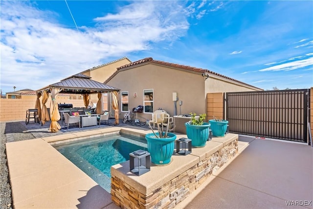 view of swimming pool with a fenced in pool, a patio area, fence, and a gazebo