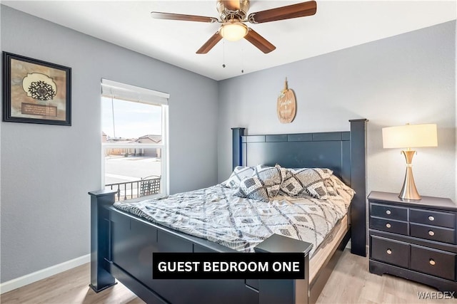 bedroom featuring light wood finished floors, ceiling fan, and baseboards