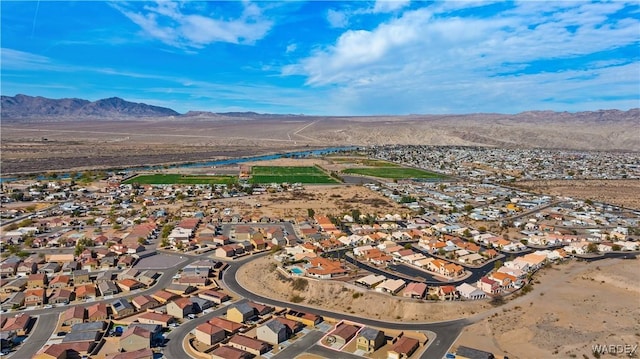 drone / aerial view featuring a residential view and a mountain view