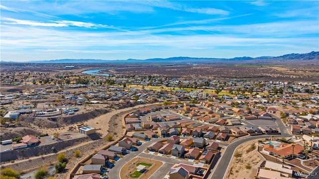 drone / aerial view featuring a residential view and a mountain view