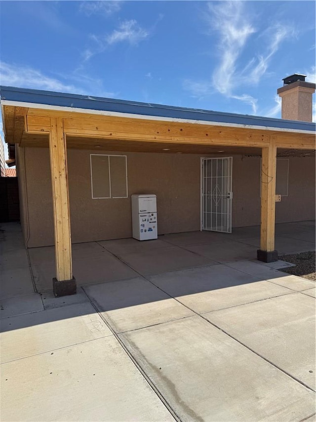 2023 E Sundance Dr, Fort Mohave, AZ 86426 - back of house featuring a patio area and a chimney