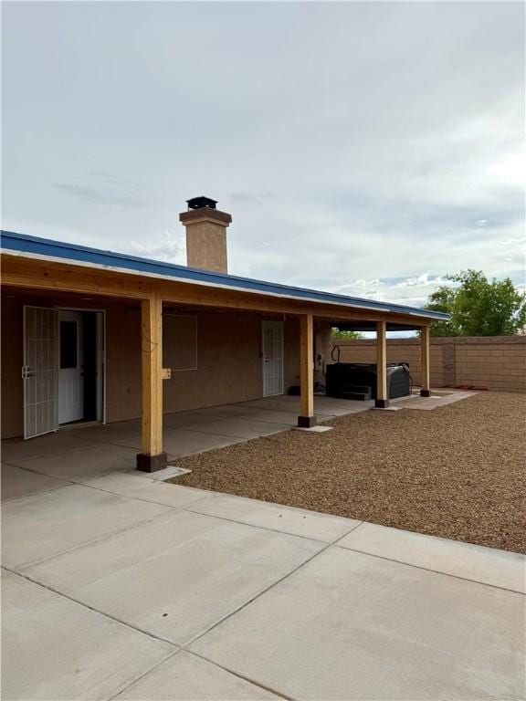 2023 E Sundance Dr, Fort Mohave, AZ 86426 - view of front facade with a patio area and a chimney