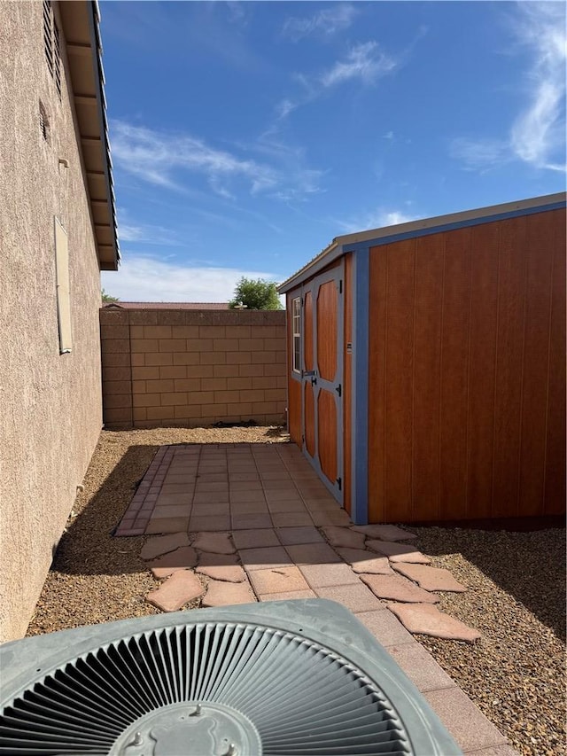 2023 E Sundance Dr, Fort Mohave, AZ 86426 - fenced backyard with cooling unit and a patio area