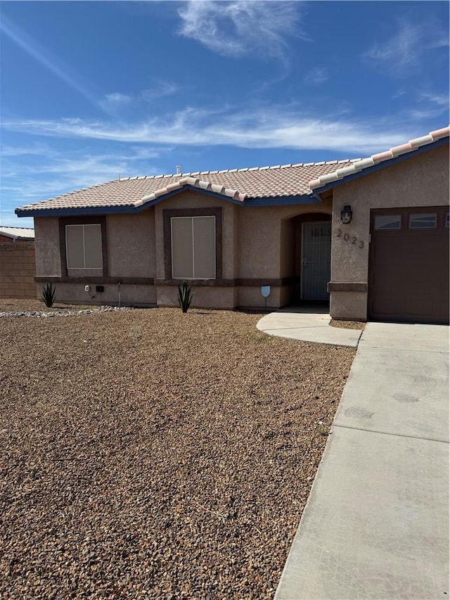 2023 E Sundance Dr, Fort Mohave, AZ 86426 - single story home featuring stucco siding, driveway, a garage, and a tiled roof