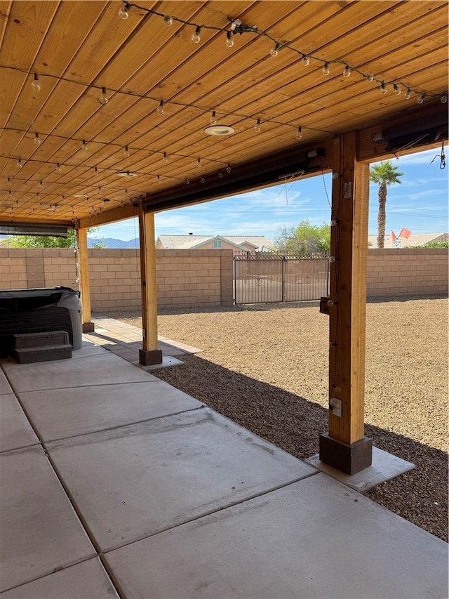 2023 E Sundance Dr, Fort Mohave, AZ 86426 - fenced backyard with a patio and a hot tub