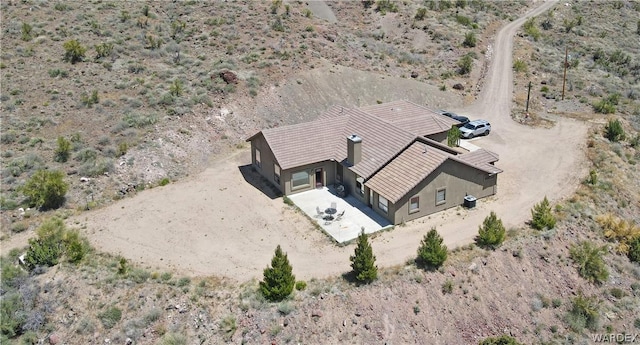 drone / aerial view featuring a desert view