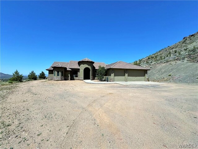 birds eye view of property with a mountain view