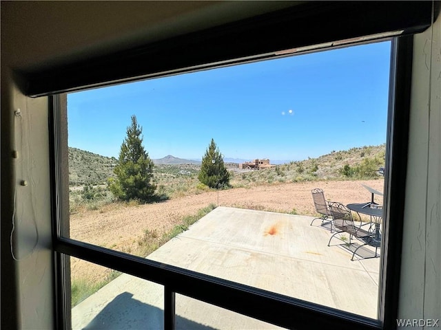 view of patio / terrace featuring a mountain view