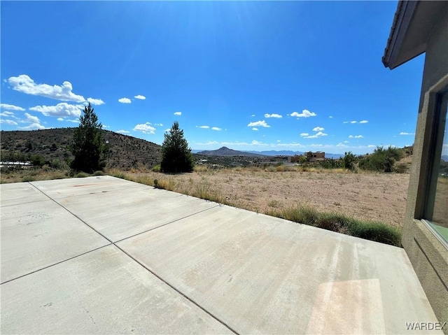 view of patio with a mountain view