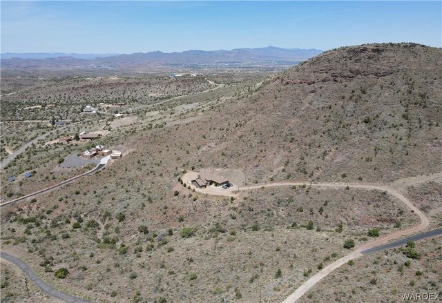 bird's eye view featuring a desert view and a mountain view