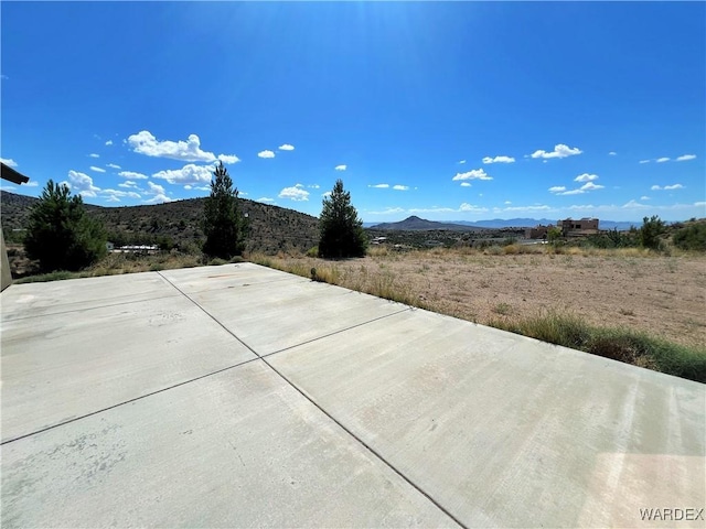 view of patio with a mountain view