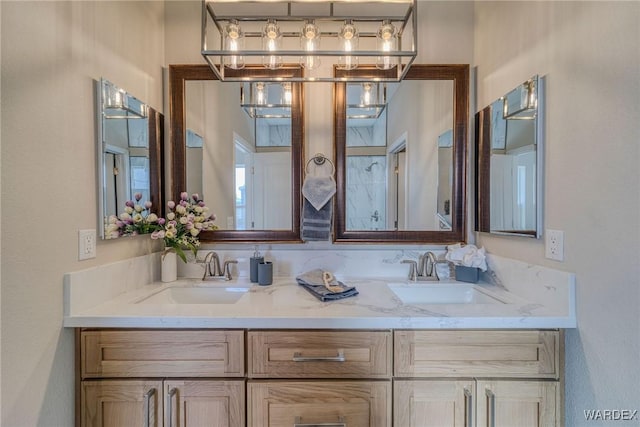 bathroom with a sink and double vanity