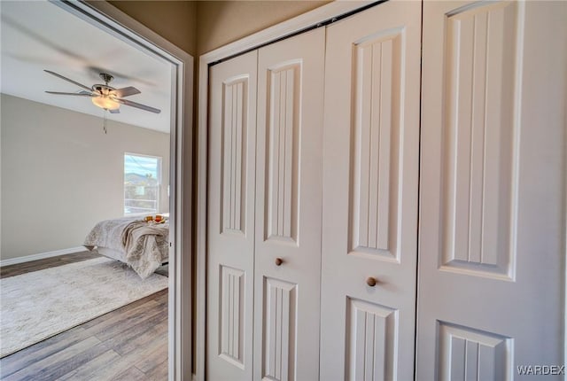 interior details with ceiling fan and wood finished floors