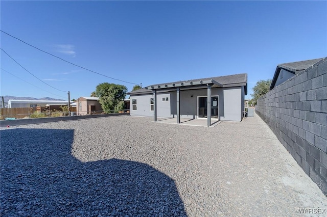 back of house with a patio area and fence