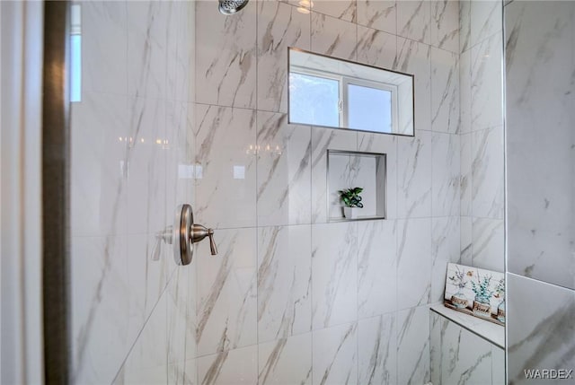 bathroom featuring tiled shower