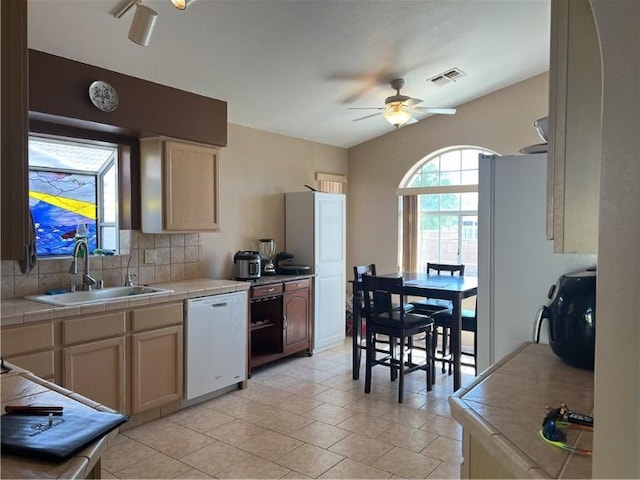 3454 Beale St, Bullhead City, AZ 86442 - kitchen featuring white appliances, a sink, ceiling fan, tile counters, and tasteful backsplash