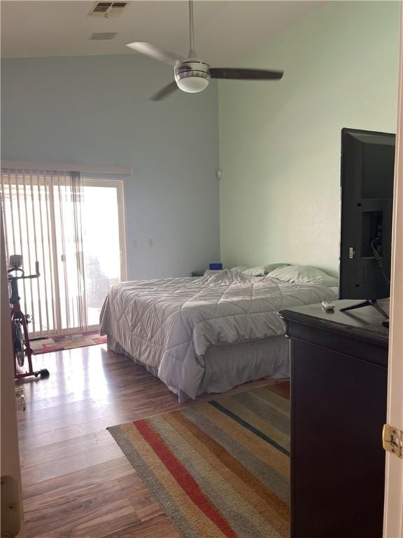 3454 Beale St, Bullhead City, AZ 86442 - bedroom with access to outside, wood finished floors, lofted ceiling, and ceiling fan