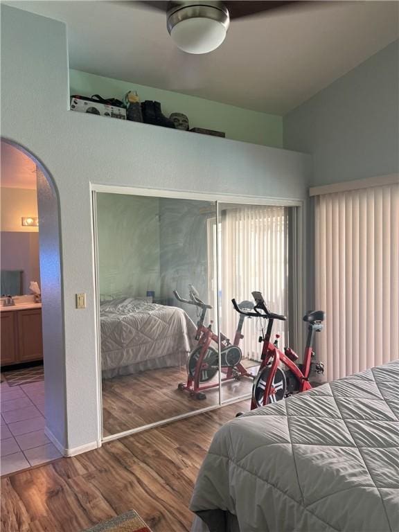 3454 Beale St, Bullhead City, AZ 86442 - bedroom featuring arched walkways, wood finished floors, and vaulted ceiling