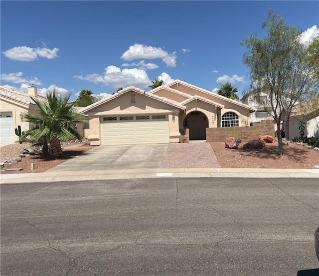 3454 Beale St, Bullhead City, AZ 86442 - ranch-style home with a garage, concrete driveway, and stucco siding