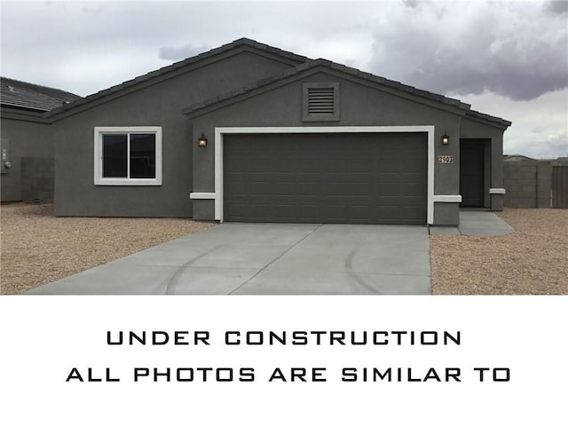 2791 E Cerro Vis, Kingman, AZ 86409 - ranch-style house featuring an attached garage, driveway, and stucco siding