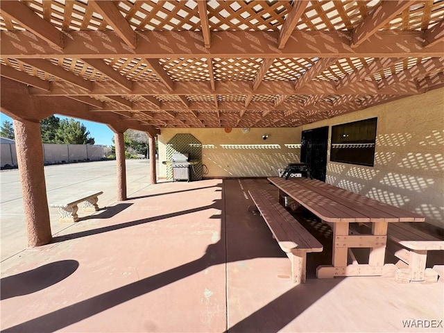 view of patio with fence and a pergola