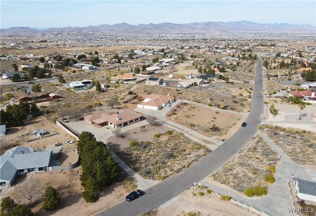 birds eye view of property with view of desert and a mountain view