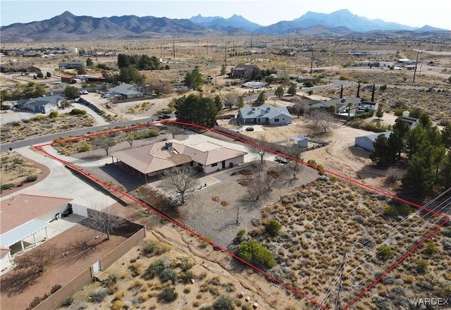 bird's eye view featuring a mountain view and view of desert