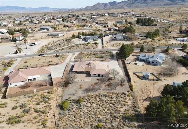 birds eye view of property featuring a residential view, a mountain view, and a desert view