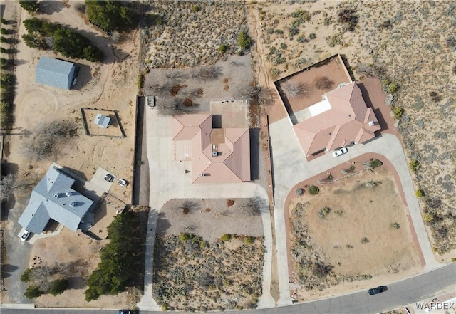 birds eye view of property with a desert view