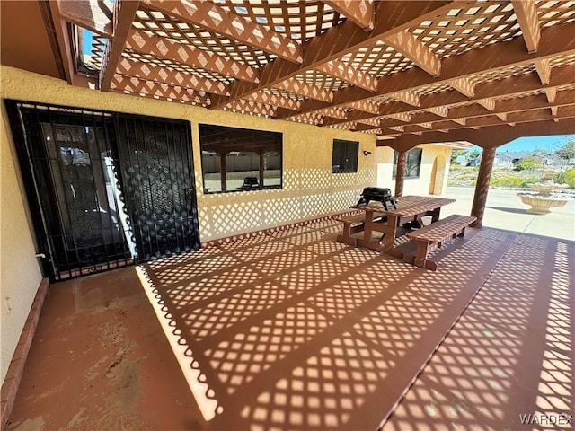 view of patio with electric panel and a pergola