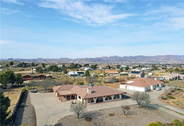 drone / aerial view featuring a residential view and a mountain view