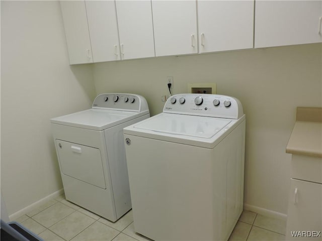 2353 Halfmoon Way, Bullhead City, AZ 86442 - laundry area featuring light tile patterned floors, baseboards, cabinet space, and washer and clothes dryer