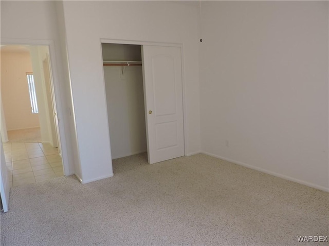 2353 Halfmoon Way, Bullhead City, AZ 86442 - unfurnished bedroom with carpet flooring, baseboards, and a closet