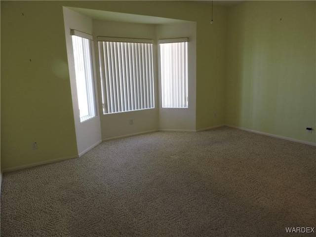 2353 Halfmoon Way, Bullhead City, AZ 86442 - carpeted empty room featuring plenty of natural light and baseboards