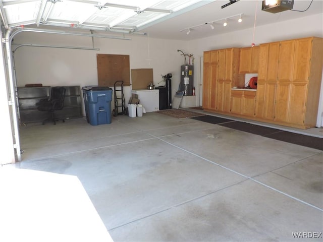 2353 Halfmoon Way, Bullhead City, AZ 86442 - garage with water heater and a garage door opener