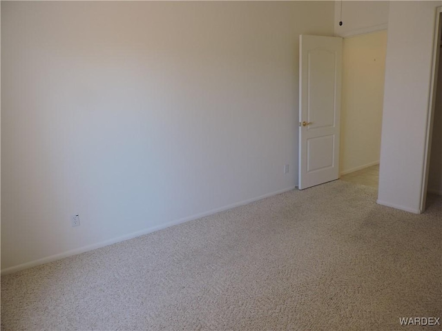 2353 Halfmoon Way, Bullhead City, AZ 86442 - unfurnished room with baseboards and light carpet