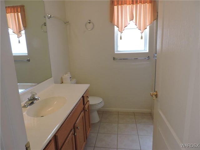 2353 Halfmoon Way, Bullhead City, AZ 86442 - bathroom featuring toilet, tile patterned floors, and vanity