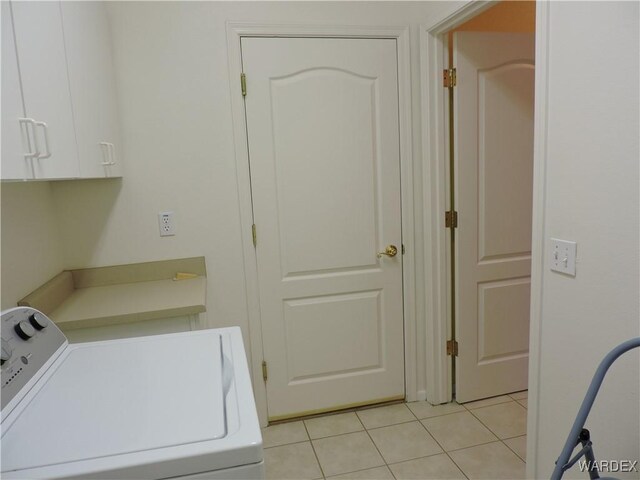 2353 Halfmoon Way, Bullhead City, AZ 86442 - laundry room featuring cabinet space, washing machine and dryer, and light tile patterned floors