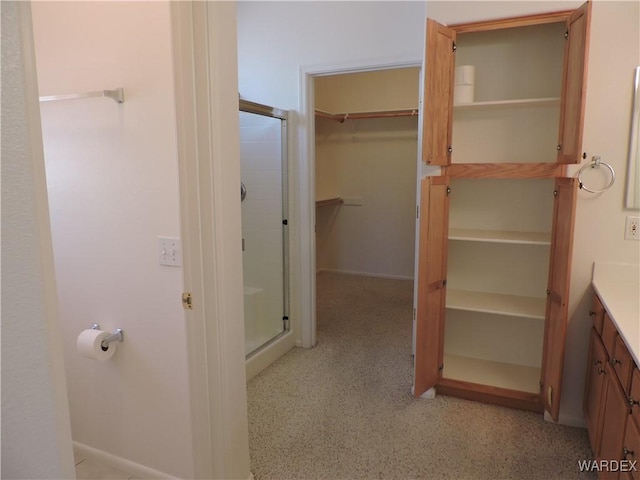 2353 Halfmoon Way, Bullhead City, AZ 86442 - full bath with vanity, a shower stall, and a spacious closet