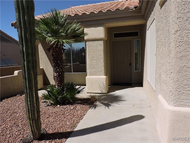 2353 Halfmoon Way, Bullhead City, AZ 86442 - property entrance featuring a tiled roof and stucco siding