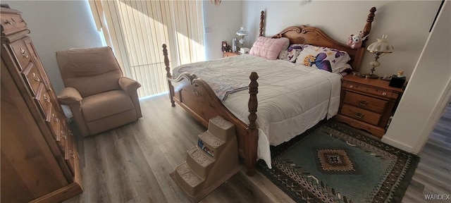 bedroom with wood finished floors