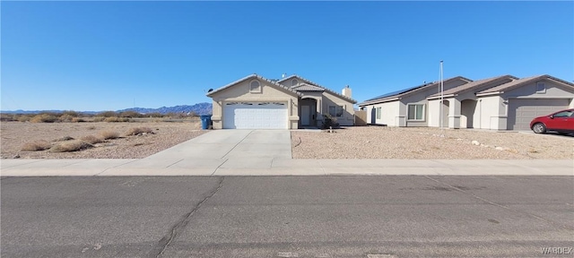 view of front of property featuring a garage and concrete driveway