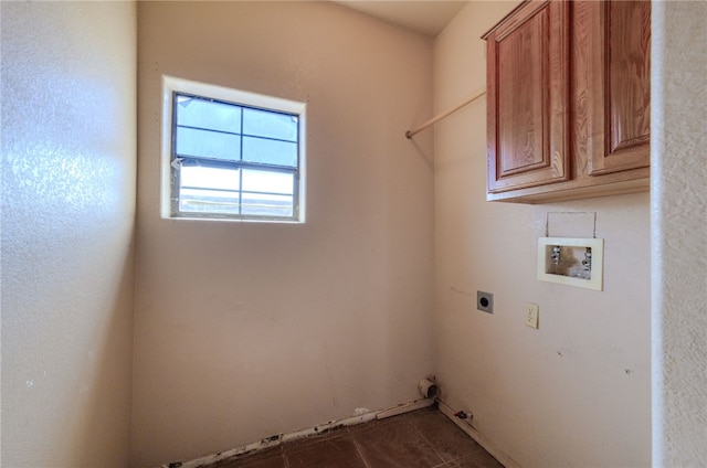 2230 Diamond Creek Rd, Bullhead City, AZ 86442 - laundry area with cabinet space, hookup for an electric dryer, washer hookup, dark tile patterned flooring, and gas dryer hookup